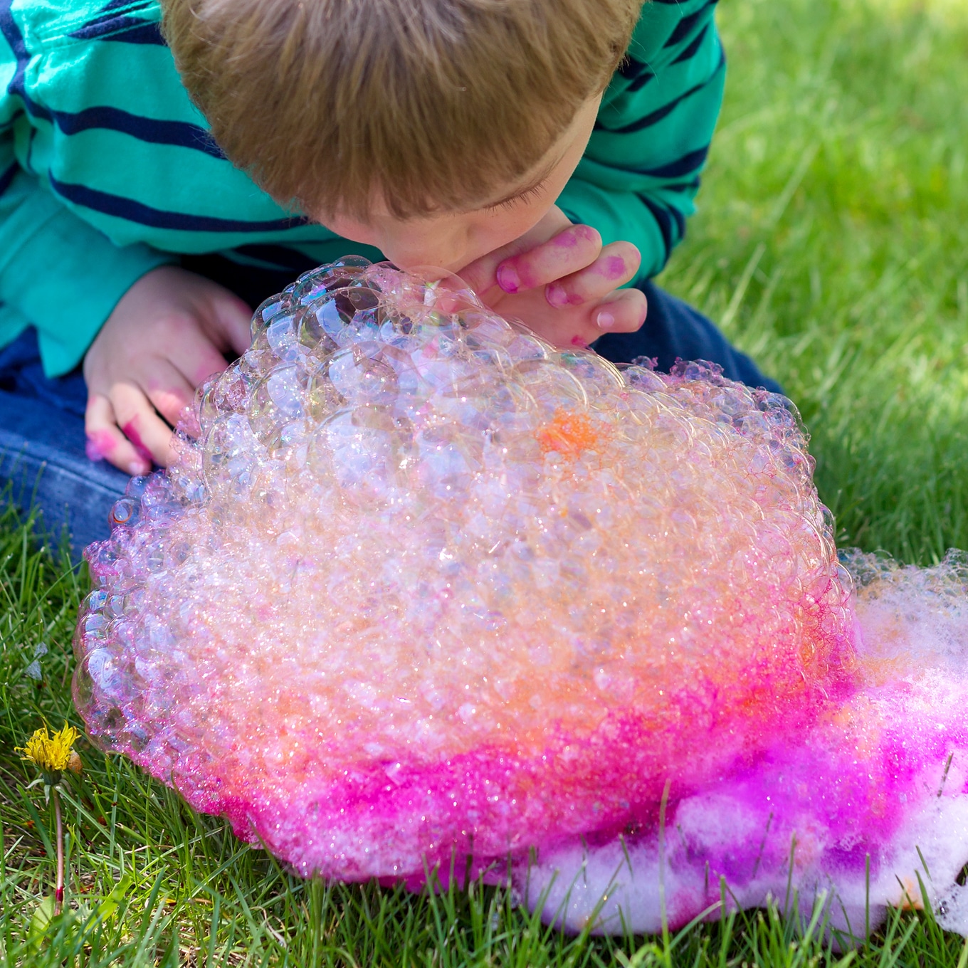 Child Blowing Bubbles for Bubble Painting